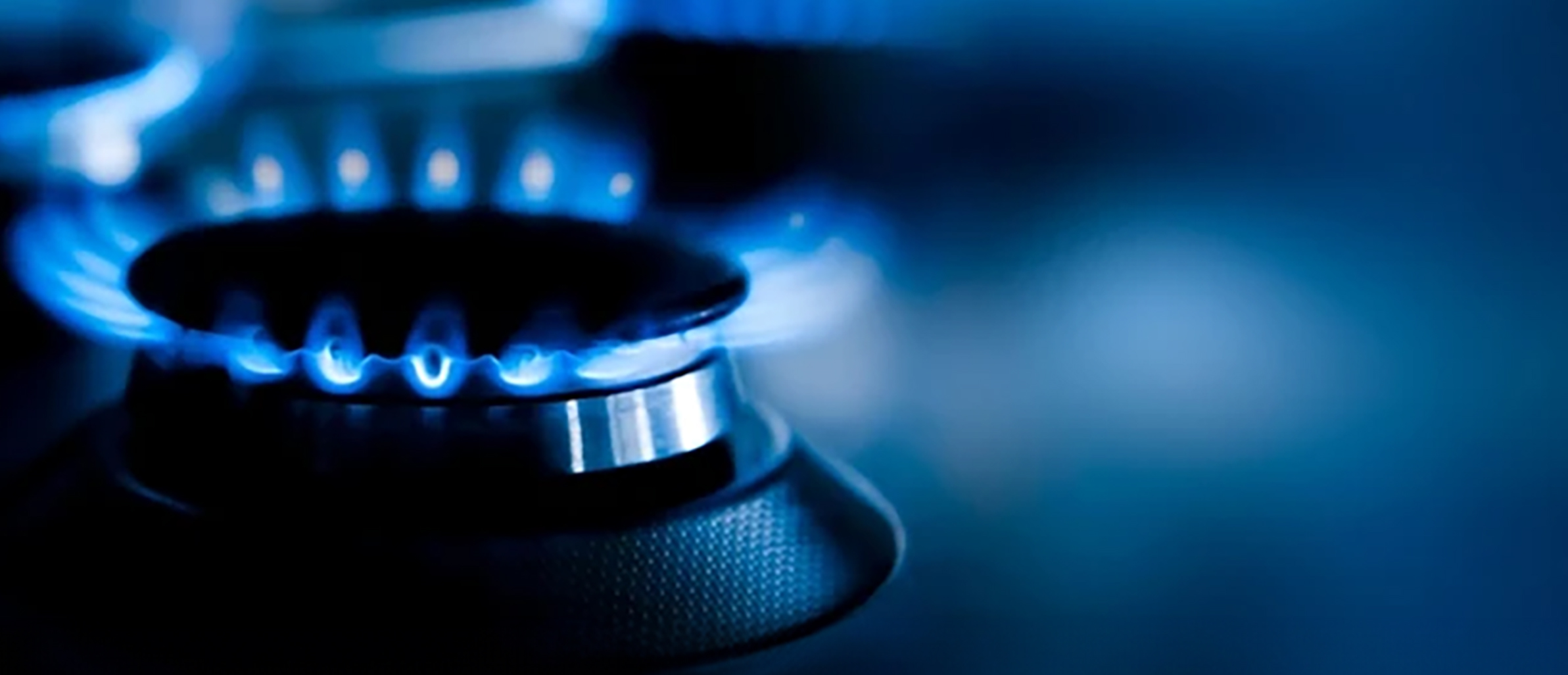 An old stove being carefully removed from a kitchen.