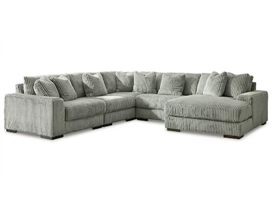 A sectional sofa being dismantled for removal.